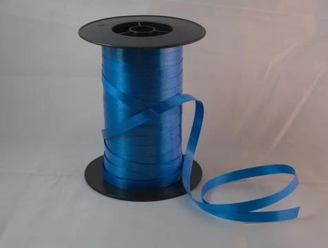 Gift strings on plastic reels. Stock Photos