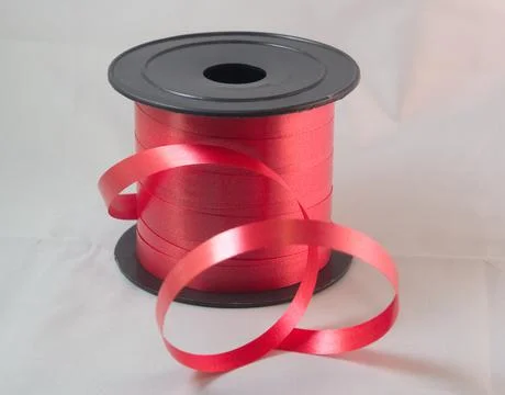 Gift strings on plastic reels. Stock Photos