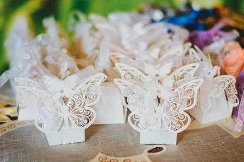 Gift wedding boxes decorated with paper butterflies Stock Photos