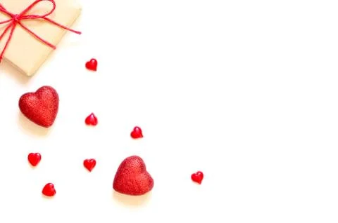 A gift on a white background with decorations. The concept of the St. Valenti Foto stock