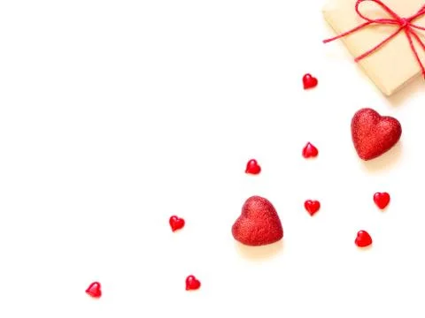 A gift on a white background with decorations. The concept of the St. Valenti Stock-Fotos