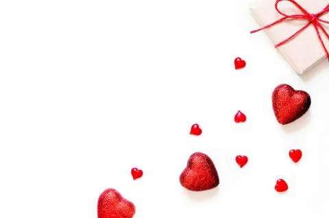 A gift on a white background with decorations. The concept of the St. Valenti Foto stock