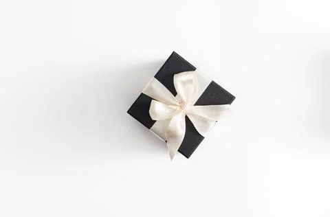 A gift on a white background. Open gift box with red ribbon on white backgrou Stock Photos