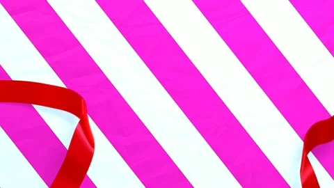The gift wrap opens and presents a surprise. Red Ribbon, Pink Gift Box. 4K Stock Footage 201985864