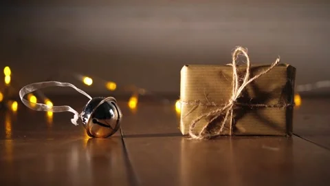 Gift wrapped in brown paper and string Stock Footage 296596909