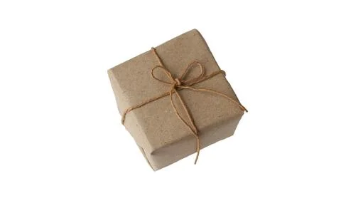 Gift wrapped in plain paper Stock Photos