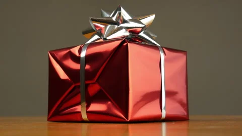 A gift wrapped in red gift paper for a special occasion Stock Footage 150357065