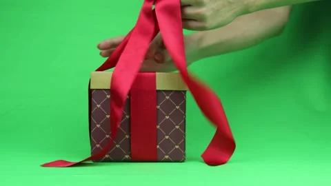Gift wrapping close up. Box with a red bow. Chromakey. Stock Footage 145552770