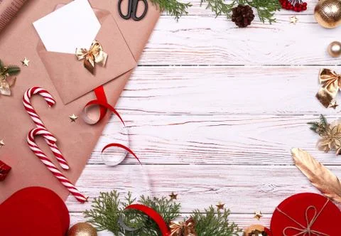 Gift wrapping. Packaging christmas present box in paper. Top view of white table Stock Photos