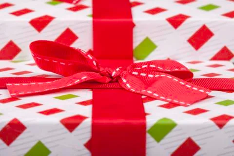 Gift wrapping with a red bow Stock Photos