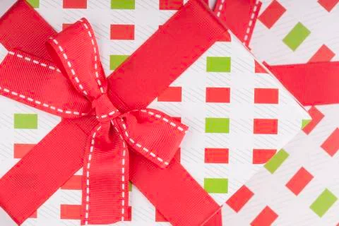 Gift wrapping with a red bow Stock Photos