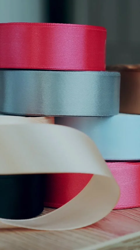 Gift wrapping ribbons. multicolored silk ribbons, ribbon reels for packaging, Video stock 323438603