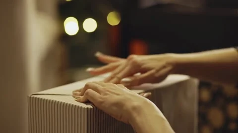 Gift Wrapping - Sealing Gift Wrapper With Adhesive Tape. - closeup shot Stock Footage 332944714