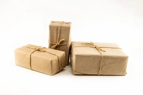 Giftbox set in brown craft packaging on white isolated background Stock Photos