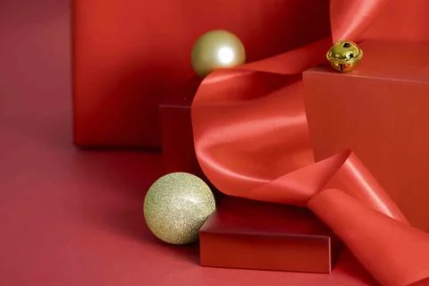 Gifting with Elegance, mockup red-themed podium presenting cosmetics as ele.. Stock Photos