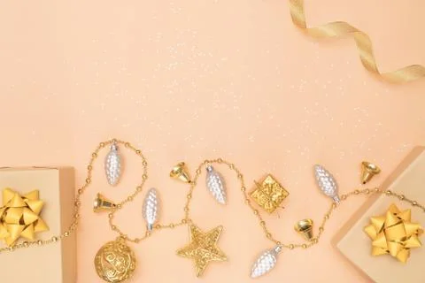 Gifts boxes or presents boxes with golden bows, star and ball on golden backg Stock Photos