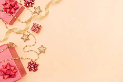 Gifts boxes or presents boxes with red bows, star and ball on golden backgrou Stock Photos