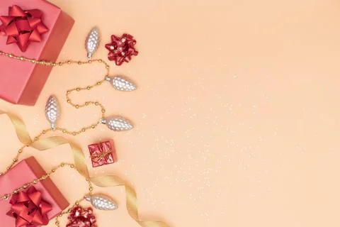 Gifts boxes or presents boxes with red bows, star and ball on golden backgrou Stock Photos