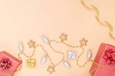 Gifts boxes or presents boxes with red bows, star and ball on golden backgrou Stock Photos