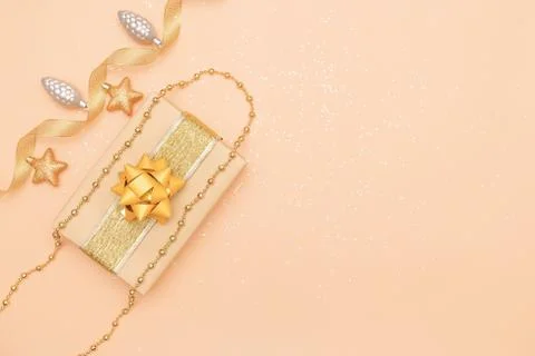 Gifts boxes or presents boxes with golden bows, star and ball on golden backg Stock Photos