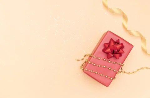 Gifts boxes or presents boxes with red bows, star and ball on golden backgrou Stock Photos