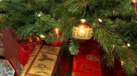 Gifts under a decorated Christmas tree Stock Footage