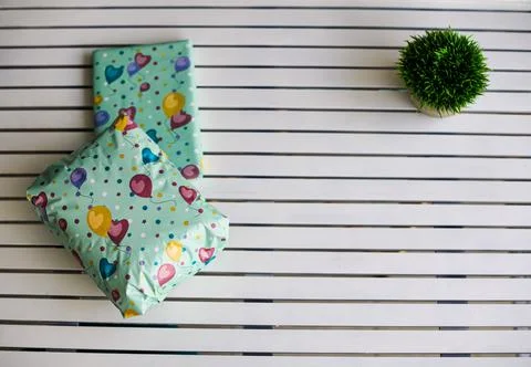 Gifts wrapped at the left part of the frame Stock Photos