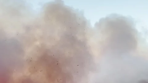 Gigantic forest fire visible from above, Smoke clouds block out the sun, The lan Stock Footage 334836694