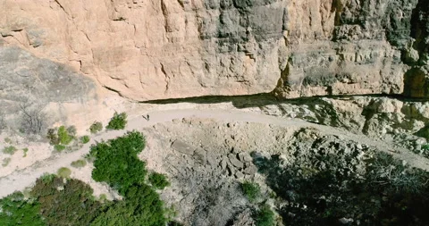Gigantic high mountain stone wall and hiking Stock Footage 146964447