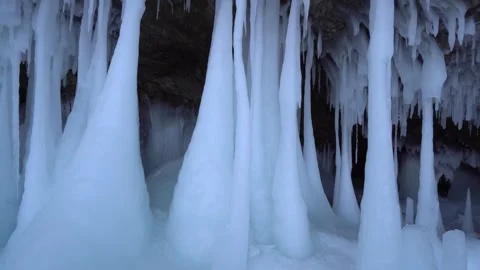 Gigantic ice formations in ancient Siberian cave. Frozen Lake Baikal, Buryatia   Stock Footage 317963490