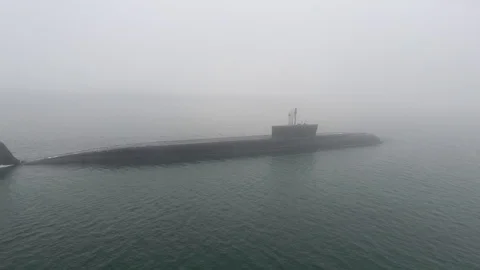 Gigantic russian navy Typhoon class atomic ballistic missile submarine floats Stock Footage 104076404