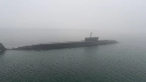Gigantic russian navy Typhoon class atomic ballistic missile submarine floats Stock Footage 104076565