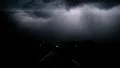 Gigantic sheet lightning in the clouds from dash cam vehicle mount Vídeos en HD