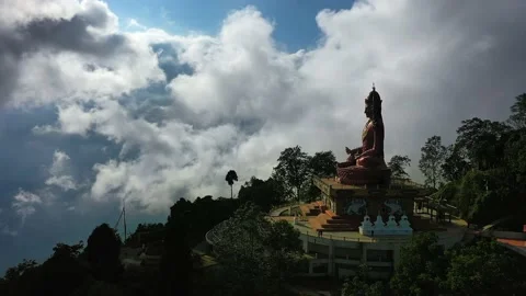 Gigantic statue above the clouds | Push in drone shot Stock Footage 133337085