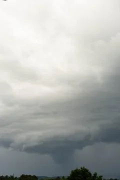 Gigantic storm cloud formation in the gray sky Stock Photos