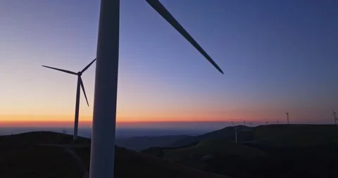 Gigantic Wind Generators Producting Clean Energy Renewable Vibrant Sunset Aerial Stock-Footage 289414223