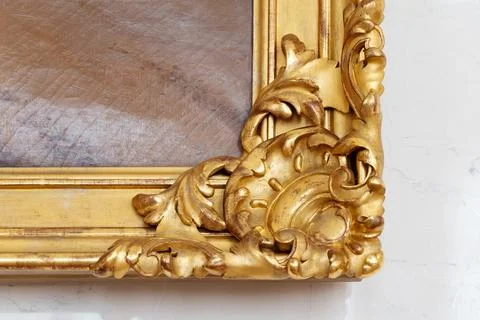 Gilded gold frame corner with ornate baroque carving Stock Photos