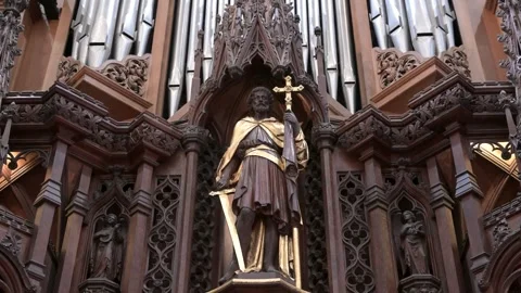 Gilded Saint Statue with Sword on Organ Case in St Albans Cathedral 스톡 동영상 345011669