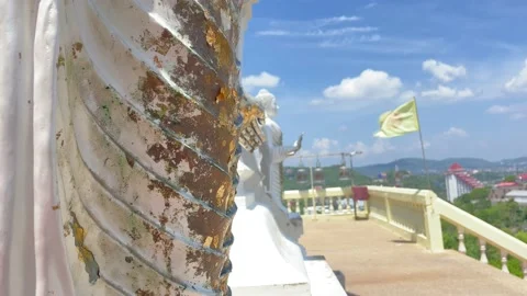 Gilding gold leaf on white statue at Wat Khao Takiap Temple sunny day blue sky Stock Footage 225121818