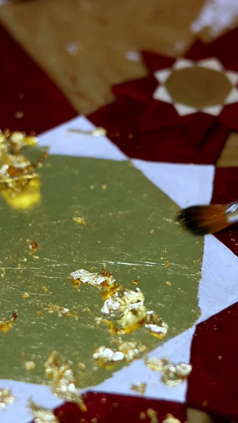 Gilding Process: Applying Gold Leaf to Artwork with Precision Stock Footage 324878142