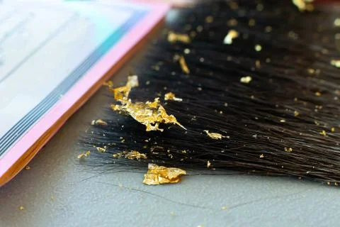 Gilding theme with a leaf of beaten gold and blade Stock Photos