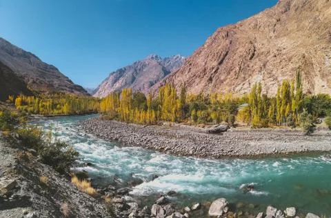 Gilgit river flowing through Gupis, Ghizer. Gilgit Baltistan, Pakistan. Stock Photos