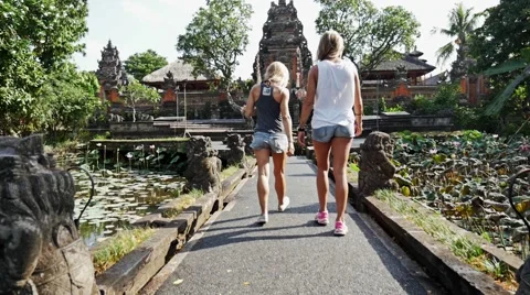 Gilrs Walking Into Temple slow motion Stock Footage 58328641