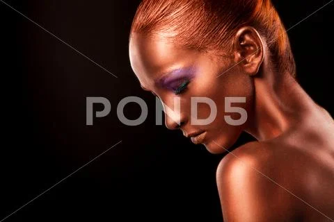 Gilt. Golden Woman's Face Closeup. Futuristic Gilded Make-up. Painted Skin Stock Photos
