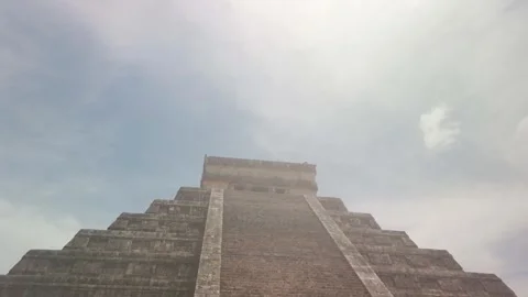 Gimbal close-up booming down shot of the ancient Mayan pyramid El Castillo Stock Footage 287356248