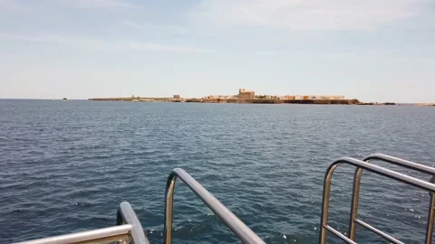 Gimbal shot on the bow with a view of the small island of Tabarca. Stock Footage 152856332