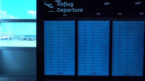 Gimbal shot. Flight Information at a timetable at International airport. 4K. Stock Footage 94960333