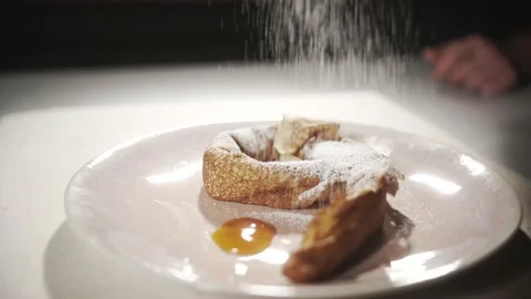 Gimbal shot of pancake with jam while putting sugar on it Stock Footage 153058890
