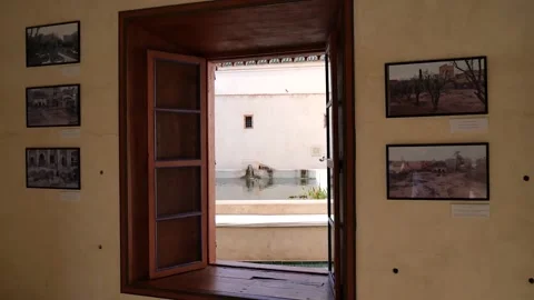 Gimbal shot in slow motion going through a window in Le Jardin Secret Marrekesh 스톡 동영상 132344048