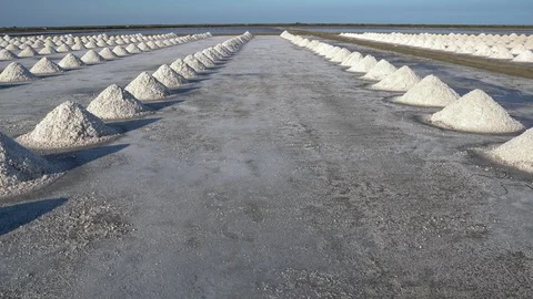 Gimbal shot,Salt farming using sunlight from the heat, Stock Footage 104459593